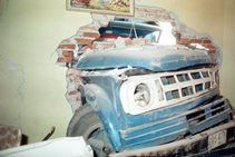 Enrique Metinides: Untitled (Pick-up truck inside a house after a collision at the Colony at Santa Fe), 1978